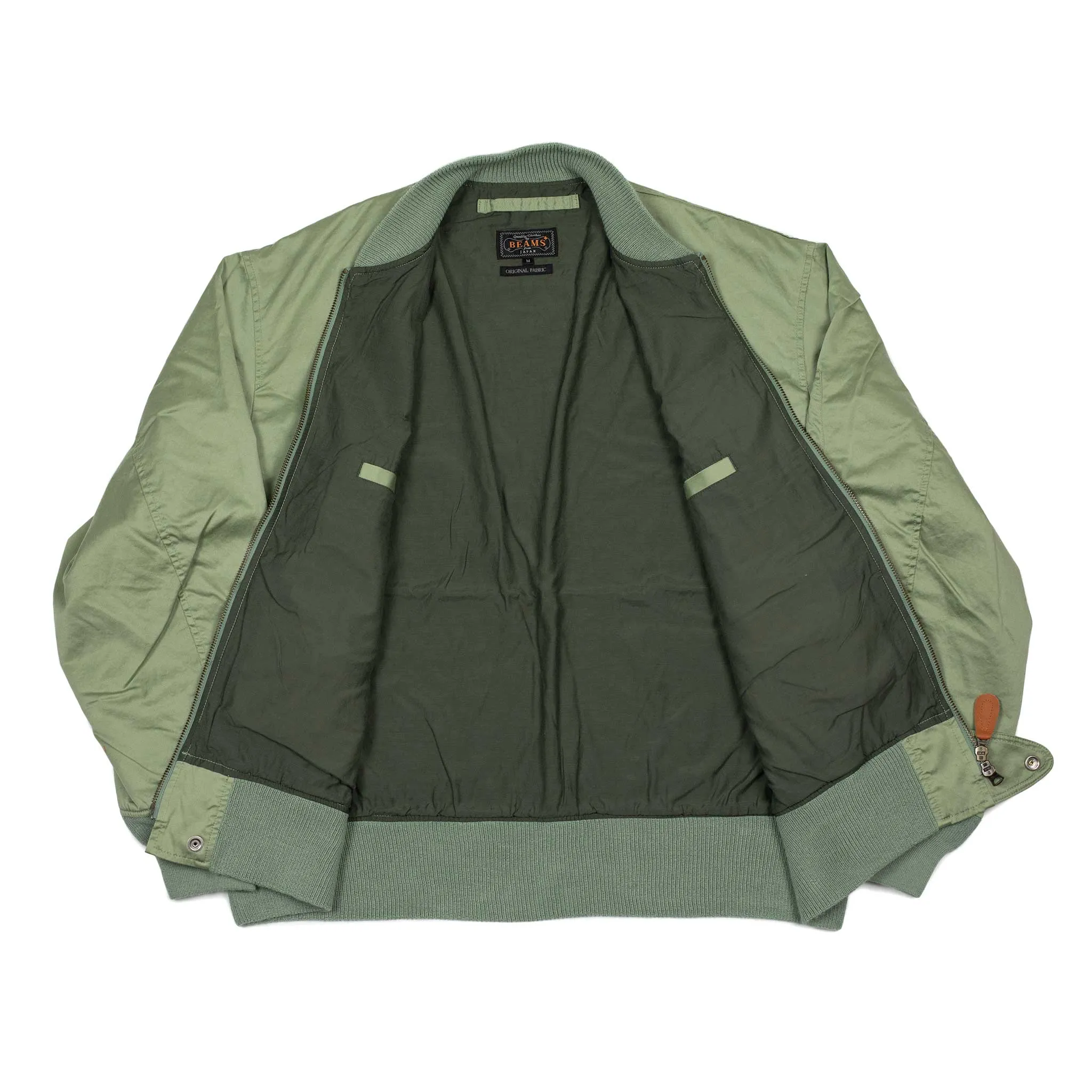 Relaxed military bomber in sage cotton sateen