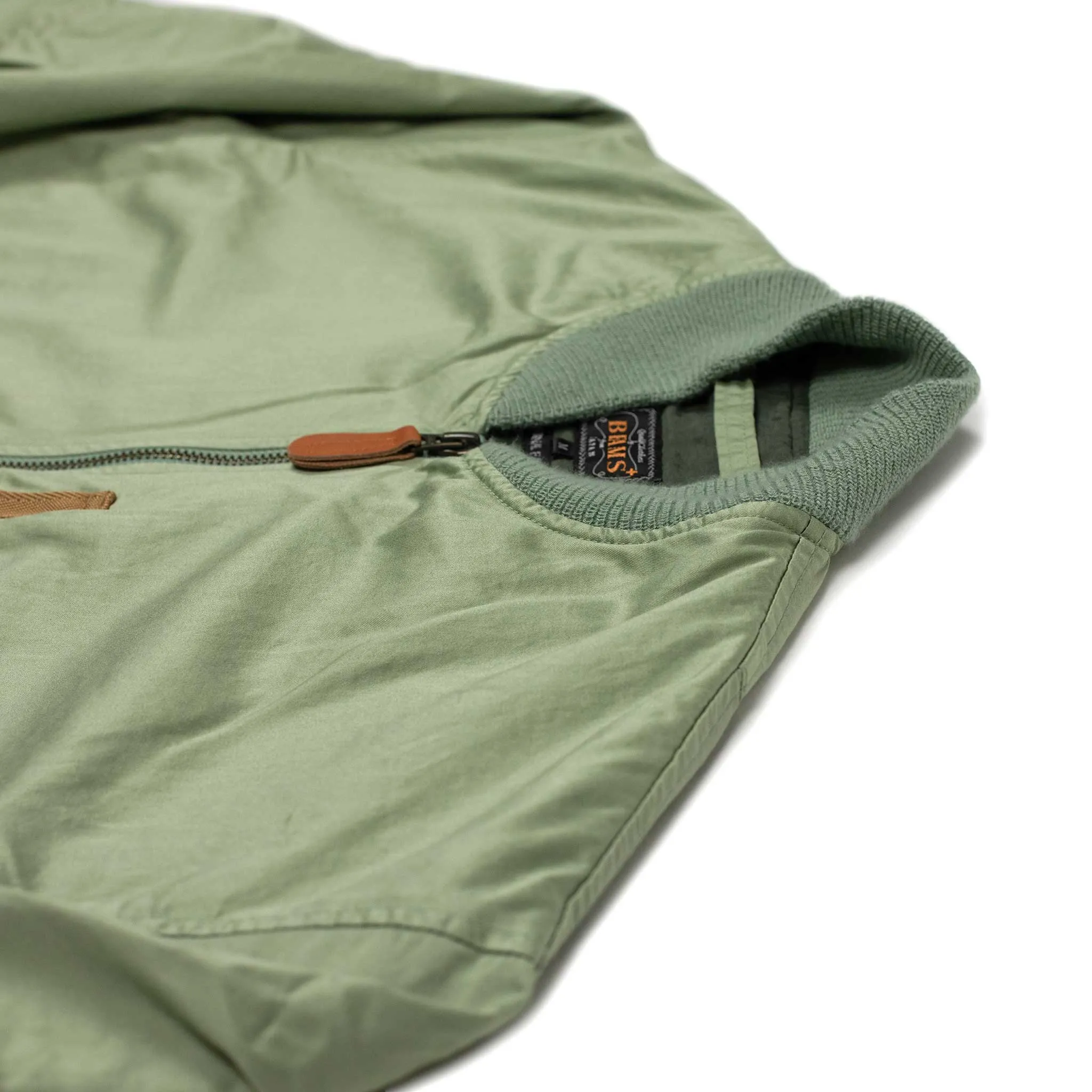 Relaxed military bomber in sage cotton sateen