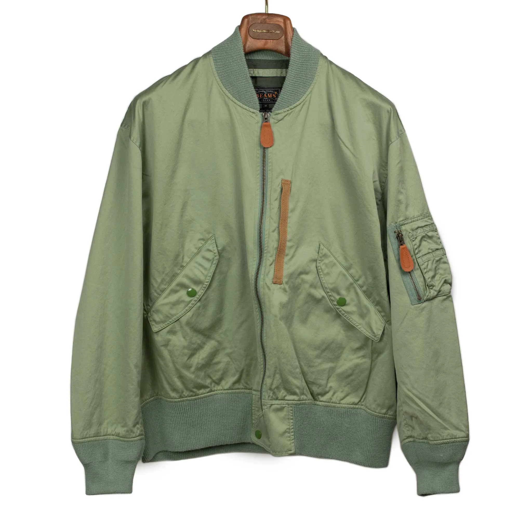 Relaxed military bomber in sage cotton sateen