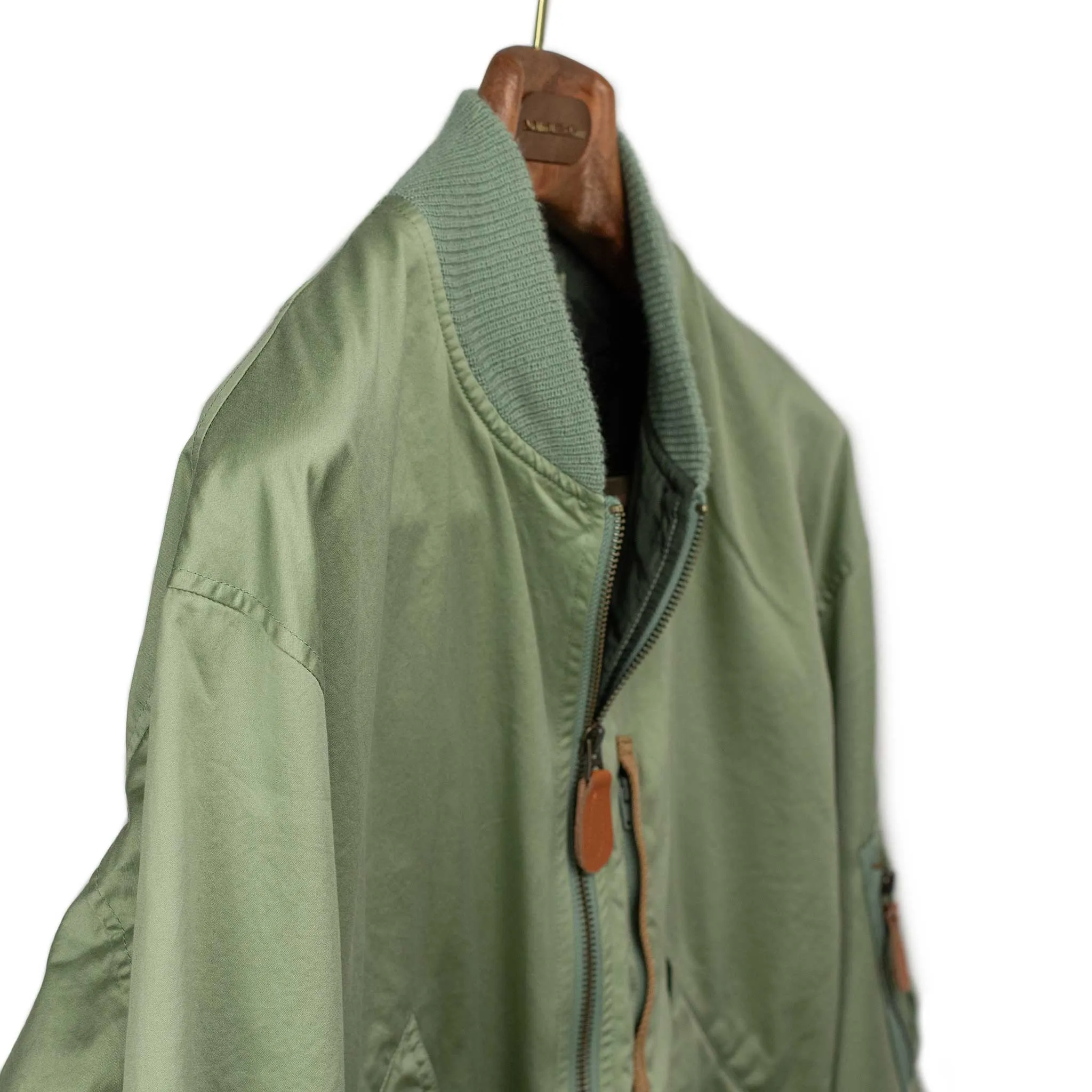 Relaxed military bomber in sage cotton sateen